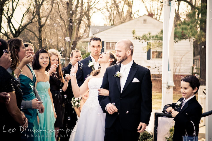 Bride and groom exiting Hope Fellowship Church greeted with bubbles. Kitty Knight House Georgetown Chestertown MD Wedding Photographer