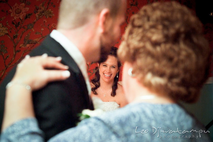 Groom and his mother dancing, bride watching and laughing. Kitty Knight House Georgetown Chestertown MD Wedding Photographer