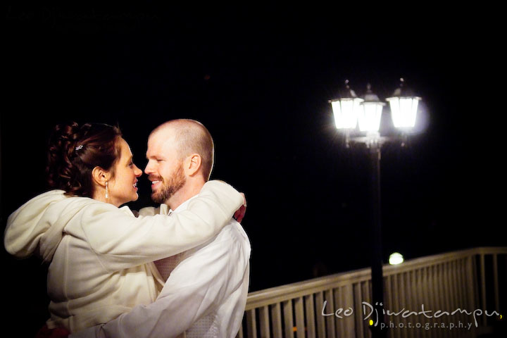 Bride and groom cuddling, hugging each other on the terrace. Kitty Knight House Georgetown Chestertown MD Wedding Photographer