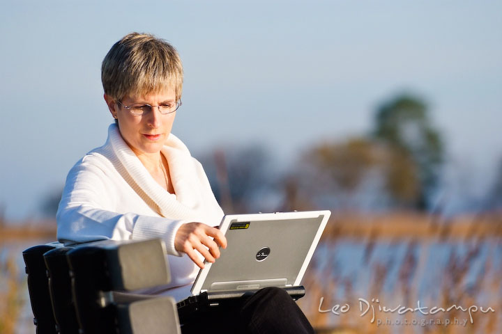 Women writer looking and working on her laptop computer. Commercial work book writer portrait photographer Annapolis, Kent Island, Eastern Shore, Maryland