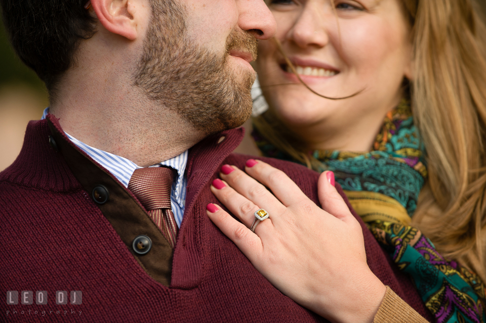 Engaged girl smiling with her fiancé showing her engagement ring. Annapolis Eastern Shore Maryland pre-wedding engagement photo session at downtown, by wedding photographers of Leo Dj Photography. http://leodjphoto.com