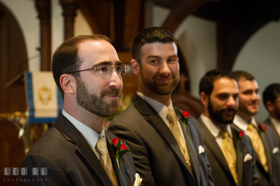 Groom was so moved by the first sight of his Bride, as she walked down the aisle escorted by her father. The Trinity Cathedral wedding, Easton, Eastern Shore, Maryland, by wedding photographers of Leo Dj Photography. http://leodjphoto.com