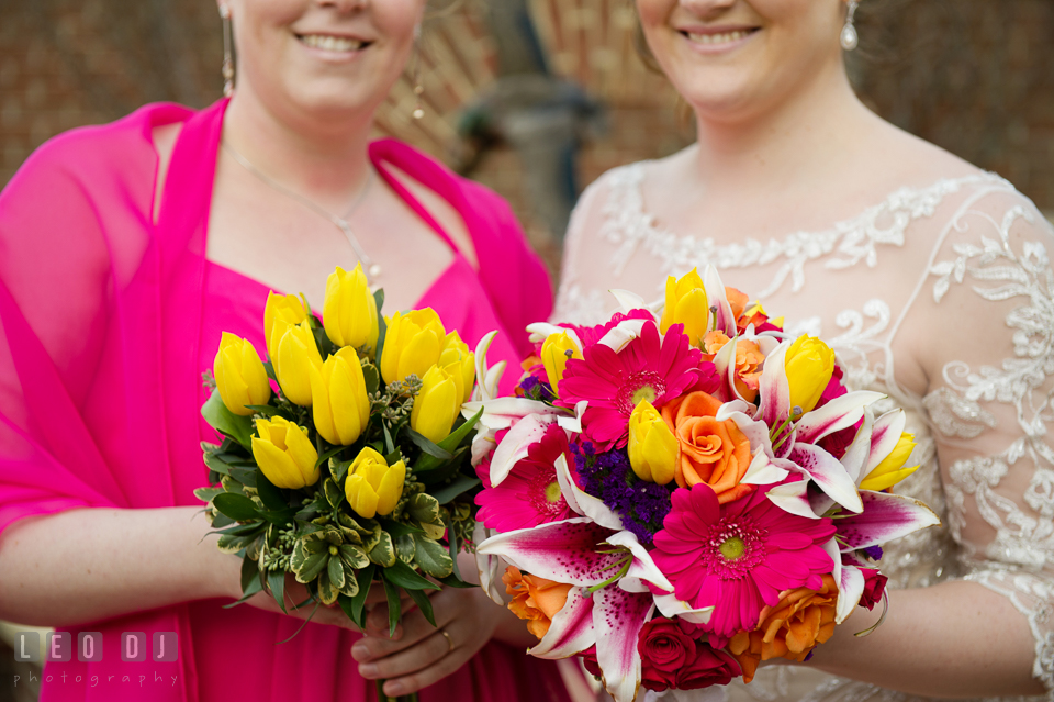 Bride and Matron of Honor showing their flower bouquets by Florist Robin's Nest. The Tidewater Inn wedding, Easton, Eastern Shore, Maryland, by wedding photographers of Leo Dj Photography. http://leodjphoto.com