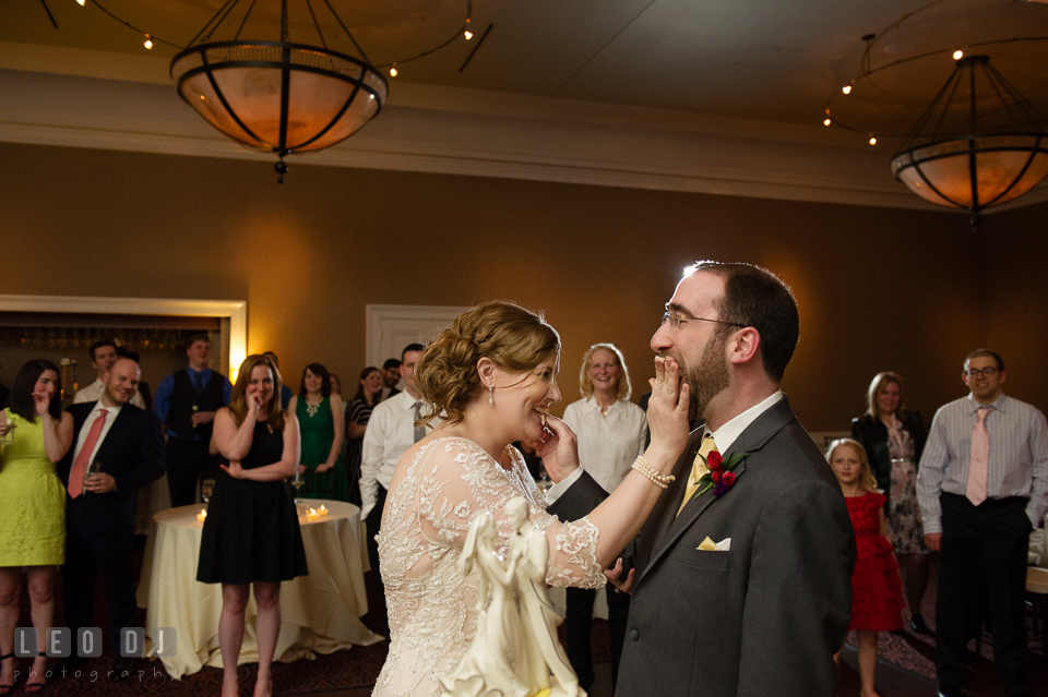 Bride and Groom smashing the wedding cake toward each other. The Tidewater Inn wedding, Easton, Eastern Shore, Maryland, by wedding photographers of Leo Dj Photography. http://leodjphoto.com