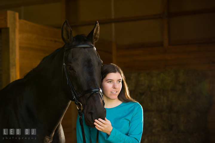 Portait of a girl and her horse. Montgomery County high school senior portrait session at Wyndham Oaks, Boyds, Maryland horse stables by photographer Leo Dj Photography. http://leodjphoto.com