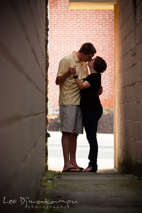 Engaged couple slow dancing in the alley and kissing. Engagement Pre-wedding Photo Session Bel Air Maryland wedding photographer