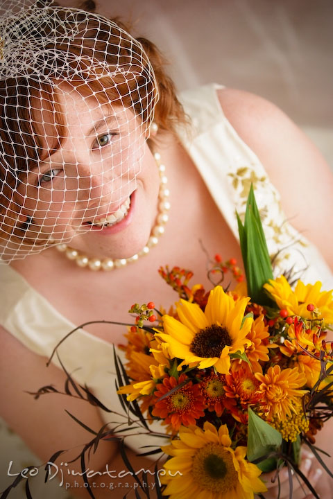Bride with bird cage veil and flower bouquet, smiling. Rock Hall, Chestertown, Kingstown, and Georgetown Maryland wedding photographer, Leo Dj Photography