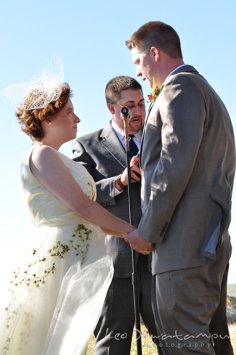 Bride and groom in front of the officiant, saying vows. Rock Hall, Chestertown, Kingstown, and Georgetown Maryland wedding photographer, Leo Dj Photography