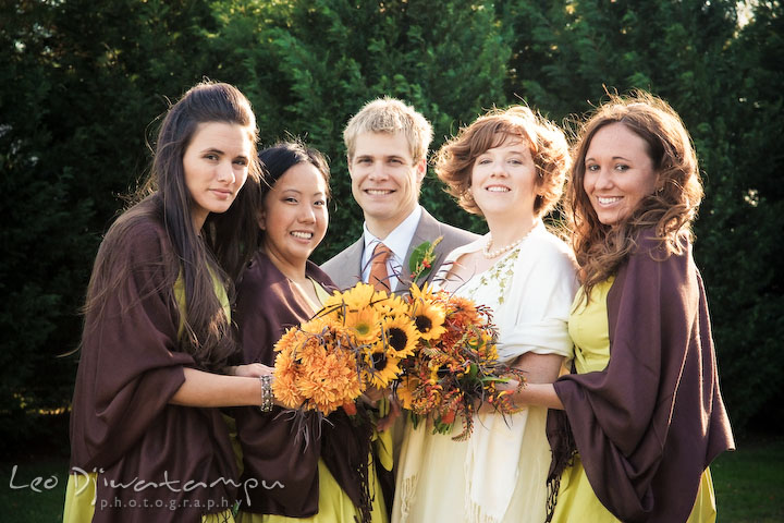 Bride, maid of honor, bridesmaids, and brides-man holding their flower bouquets. Rock Hall, Chestertown, Kingstown, and Georgetown Maryland wedding photographer, Leo Dj Photography