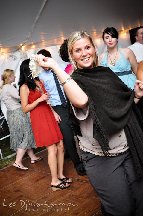 A girl guest holding garter in her hand. Rock Hall, Chestertown, Kingstown, and Georgetown Maryland wedding photographer, Leo Dj Photography