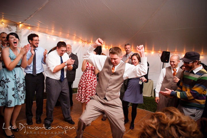 Groom dancing in a dance show of in a crowd circle. Rock Hall, Chestertown, Kingstown, and Georgetown Maryland wedding photographer, Leo Dj Photography