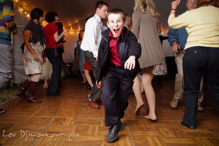 A boy dancing on the floor. Rock Hall, Chestertown, Kingstown, and Georgetown Maryland wedding photographer, Leo Dj Photography