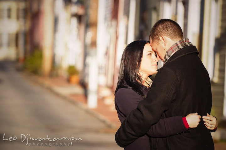 engaged couple hugging. Urban City Pre-wedding Engagement Photographer Annapolis MD