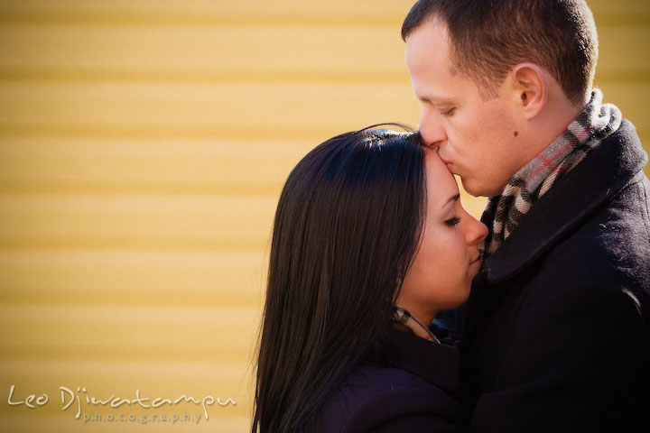 engaged couple, guy kissed girl's forehead. Urban City Pre-wedding Engagement Photographer Annapolis MD