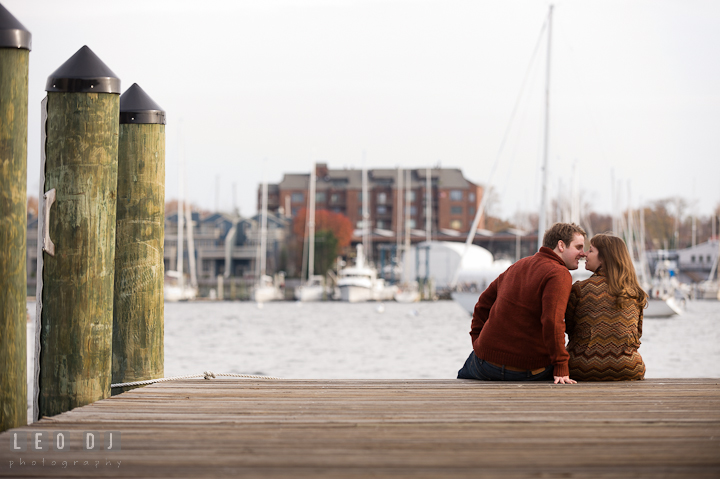 Engaged couple almost kissed on the pier. Pre-wedding engagement photo session at Annapolis, Eastport, Maryland, Quiet Waters Park, by wedding photographers of Leo Dj Photography. http://leodjphoto.com