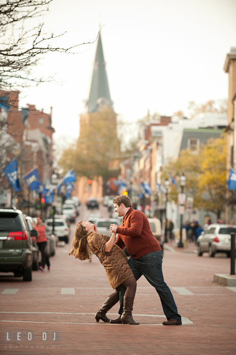 Engaged couple tango dancing on the Main street Annapolis downtown. Pre-wedding engagement photo session at Annapolis, Eastport, Maryland, Quiet Waters Park, by wedding photographers of Leo Dj Photography. http://leodjphoto.com