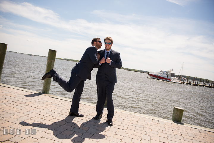 Best Man pretending to kiss Groom at Hilton Garden Inn boat pier. Kent Island Maryland Matapeake Beach wedding ceremony and getting ready photo, by wedding photographers of Leo Dj Photography. http://leodjphoto.com