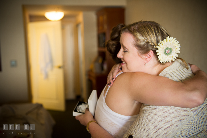 Bride hugging sister-in-law to be. Kent Island Maryland Matapeake Beach wedding ceremony and getting ready photo, by wedding photographers of Leo Dj Photography. http://leodjphoto.com