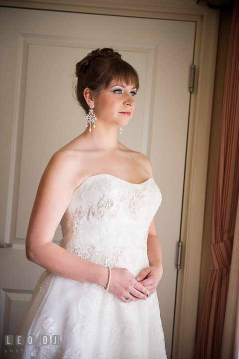 Bride standing and looking out the window. Kent Island Maryland Matapeake Beach wedding ceremony and getting ready photo, by wedding photographers of Leo Dj Photography. http://leodjphoto.com