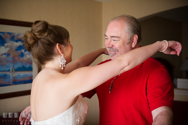 Bride trying to hug Father. Kent Island Maryland Matapeake Beach wedding ceremony and getting ready photo, by wedding photographers of Leo Dj Photography. http://leodjphoto.com