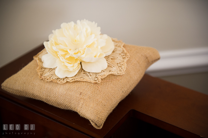 Pillow with white flower for ring bearer. Kent Island Maryland Matapeake Beach wedding ceremony and getting ready photo, by wedding photographers of Leo Dj Photography. http://leodjphoto.com