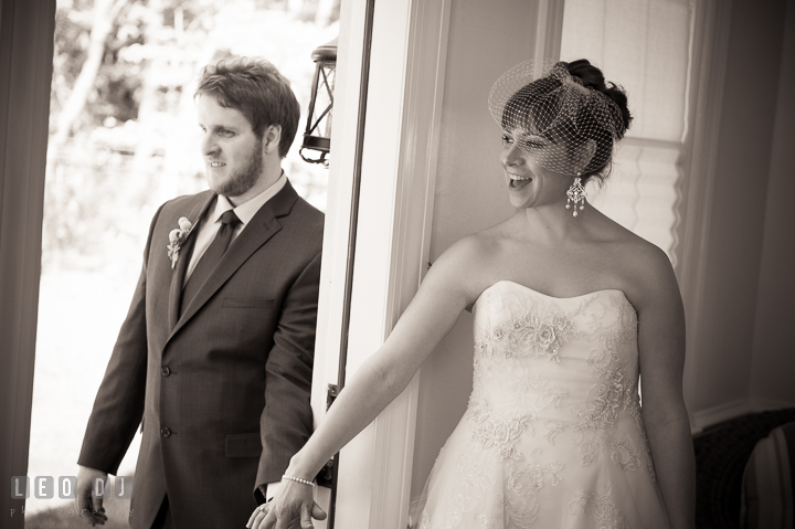 Bride and Groom holding hands before they see each other during the ceremony. Kent Island Maryland Matapeake Beach wedding ceremony and getting ready photo, by wedding photographers of Leo Dj Photography. http://leodjphoto.com