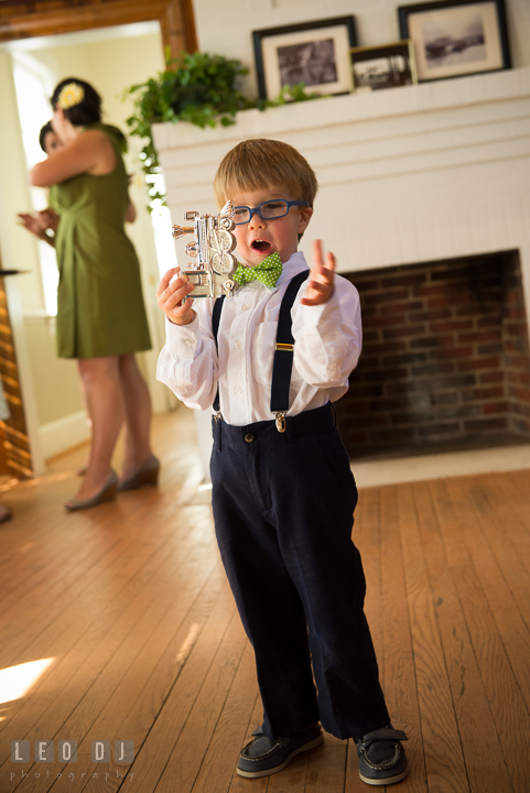 Ring bearer boy playing with his locomotive train. Kent Island Maryland Matapeake Beach wedding ceremony and getting ready photo, by wedding photographers of Leo Dj Photography. http://leodjphoto.com