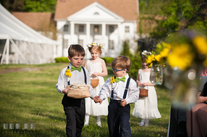 Ring bearer boys and flower girls walking down the isle. Kent Island Maryland Matapeake Beach wedding ceremony and getting ready photo, by wedding photographers of Leo Dj Photography. http://leodjphoto.com