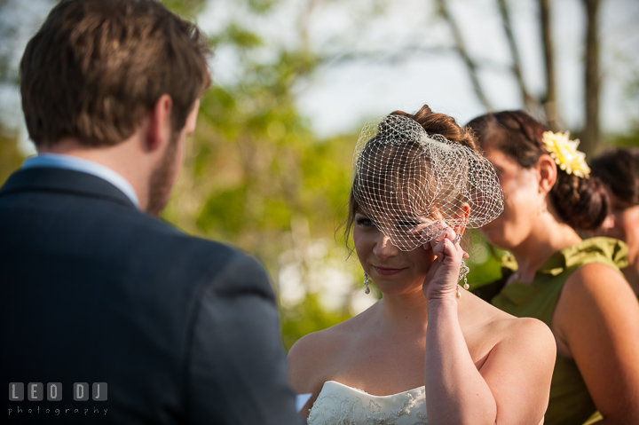 Bride crying and shed tear listening to Groom reading vow. Kent Island Maryland Matapeake Beach wedding ceremony and getting ready photo, by wedding photographers of Leo Dj Photography. http://leodjphoto.com