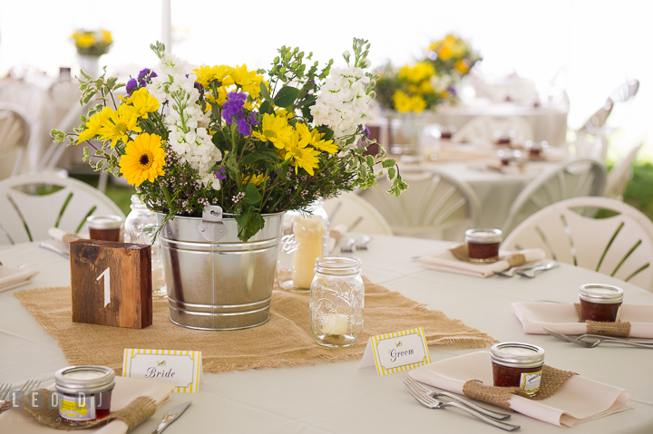 Sweetheart table with flower centerpiece and wooden table number. Kent Island Maryland Matapeake Beach wedding reception party and romantic session photo, by wedding photographers of Leo Dj Photography. http://leodjphoto.com