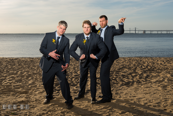 Groom, Best Man and Groomsmen goody posing on the beach with Bay Bridge in the background. Kent Island Maryland Matapeake Beach wedding reception party and romantic session photo, by wedding photographers of Leo Dj Photography. http://leodjphoto.com