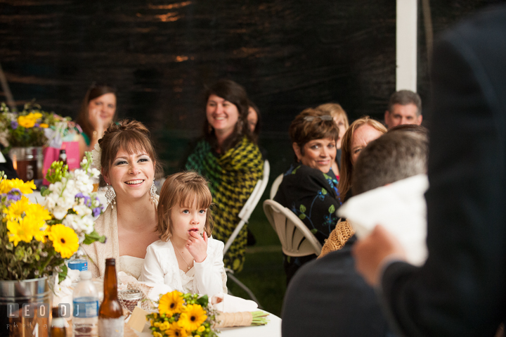 Bride laughing listening to Best Man's toast speech. Kent Island Maryland Matapeake Beach wedding reception party and romantic session photo, by wedding photographers of Leo Dj Photography. http://leodjphoto.com