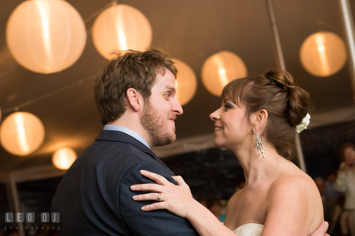 Bride and Groom smiling while doing first dance. Kent Island Maryland Matapeake Beach wedding reception party and romantic session photo, by wedding photographers of Leo Dj Photography. http://leodjphoto.com