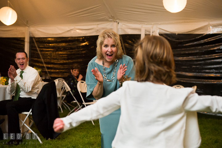 Mother of Groom cheering her granddaughter dancing. Kent Island Maryland Matapeake Beach wedding reception party and romantic session photo, by wedding photographers of Leo Dj Photography. http://leodjphoto.com