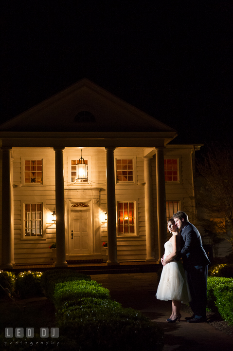 Bride and Groom hugging in front of the venue's Clubhouse. Kent Island Maryland Matapeake Beach wedding reception party and romantic session photo, by wedding photographers of Leo Dj Photography. http://leodjphoto.com