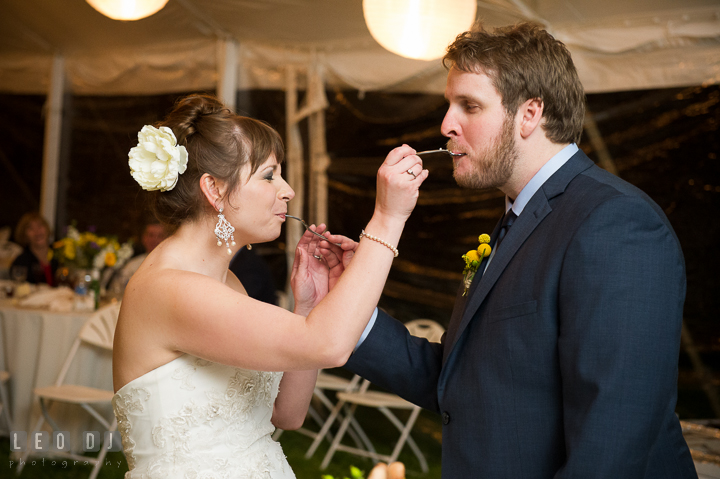 Bride and Groom feeding cake to each other. Kent Island Maryland Matapeake Beach wedding reception party and romantic session photo, by wedding photographers of Leo Dj Photography. http://leodjphoto.com