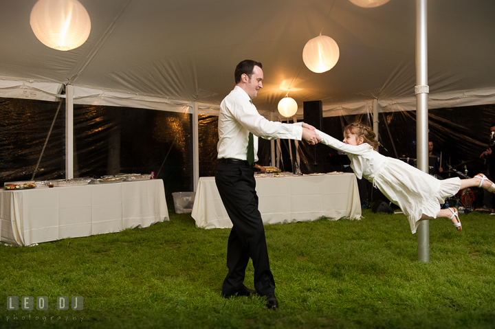 Guests swinging the flower girl high while dancing. Kent Island Maryland Matapeake Beach wedding reception party and romantic session photo, by wedding photographers of Leo Dj Photography. http://leodjphoto.com