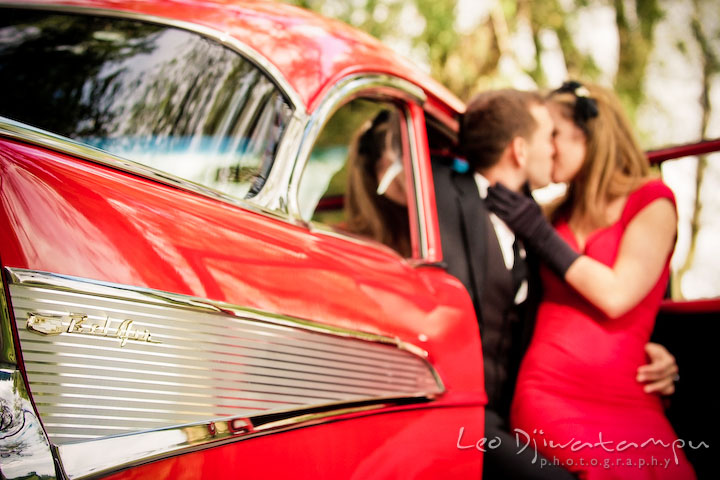 couple kissing in car. Engaged couple kissing in car.