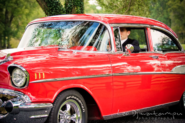 Engaged guy drove antique car with his fiancee. Pre-wedding engagement photography session old antique Chevy Bel Air car, dress, outfit, accessories, suitcases