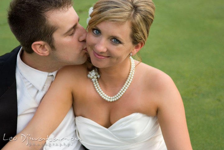 Groom kissed bride during romantic session. Turf Valley, Ellicott City, Maryland wedding photos by photographers of Leo Dj Photography