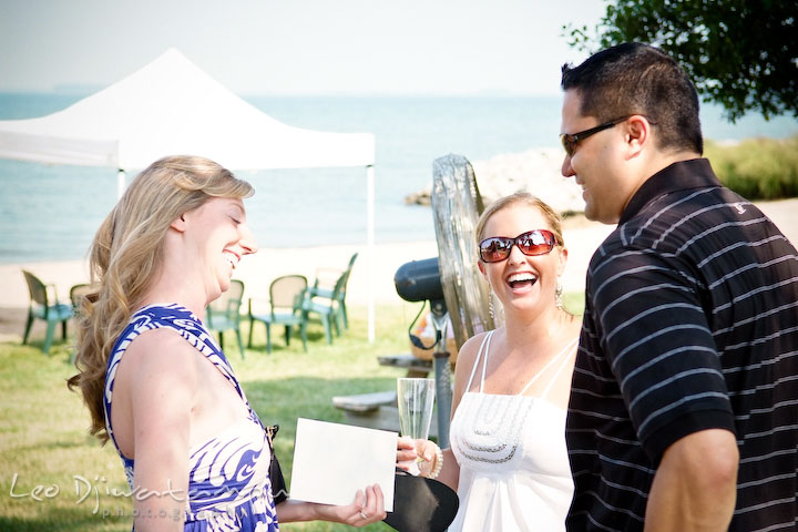 Bride laughing with guests. Cove Creek Country Club, Stevensville, Kent Island, Eastern Shore, Maryland Wedding Photographer, beach wedding photographer