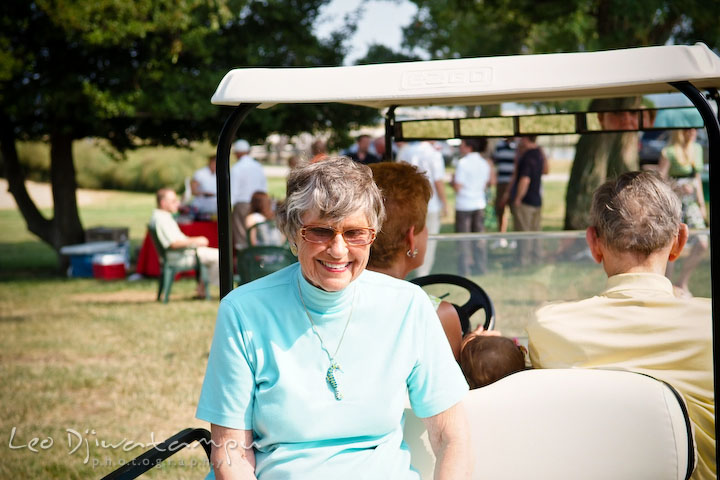 Guests ride on a golfcart. Cove Creek Country Club, Stevensville, Kent Island, Eastern Shore, Maryland Wedding Photographer, beach wedding photographer