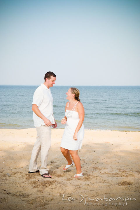 Bride and groom laughing and playing on the beach. Cove Creek Country Club, Stevensville, Kent Island, Eastern Shore, Maryland Wedding Photographer, beach wedding photographer