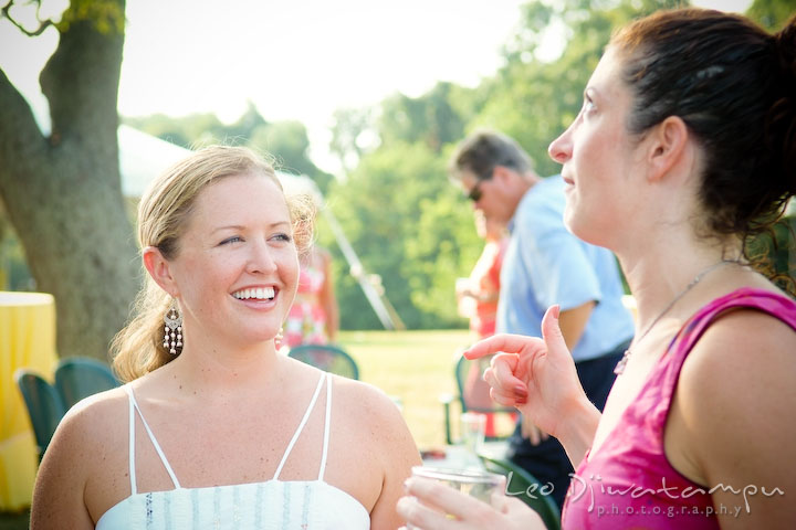 Bride talking to guest, smiling. Cove Creek Country Club, Stevensville, Kent Island, Eastern Shore, Maryland Wedding Photographer, beach wedding photographer