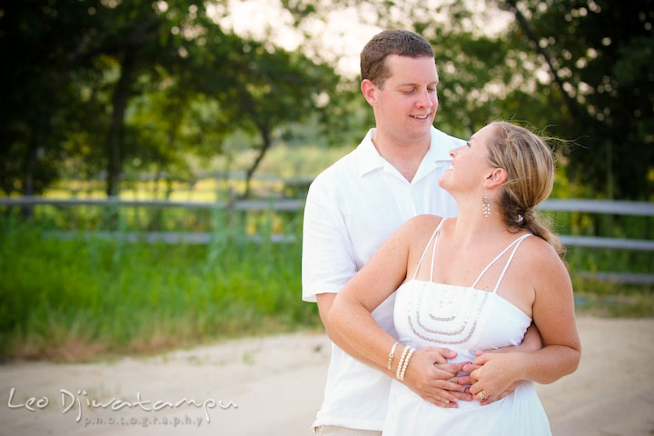 Bride and groom hugging and looking at each other. Cove Creek Country Club, Stevensville, Kent Island, Eastern Shore, Maryland Wedding Photographer, beach wedding photographer