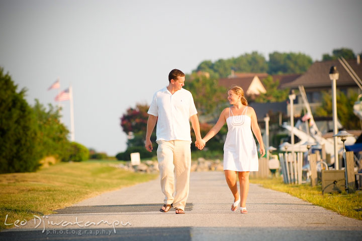 Bride and groom walking down together by the beach pier. Cove Creek Country Club, Stevensville, Kent Island, Eastern Shore, Maryland Wedding Photographer, beach wedding photographer