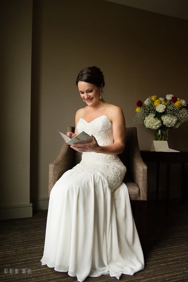 Westin Annapolis Hotel bride reading card from groom photo by Leo Dj Photography