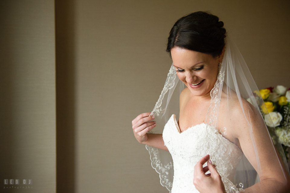 Westin Annapolis Hotel bride smiling holding veil photo by Leo Dj Photography