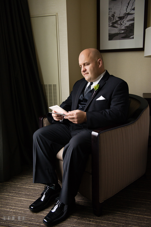 Westin Annapolis Hotel groom reading card from bride photo by Leo Dj Photography