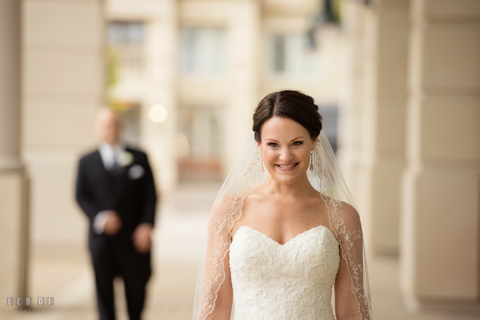 Westin Annapolis Hotel bride smiling as groom approaching during first look photo by Leo Dj Photography